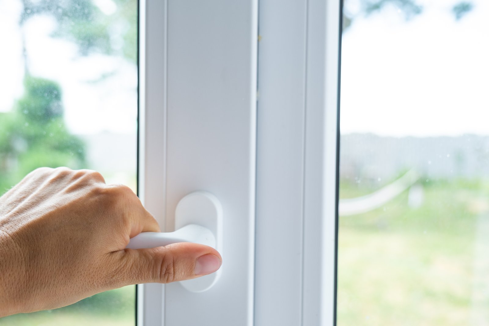UPVC Window Handle Being Opened